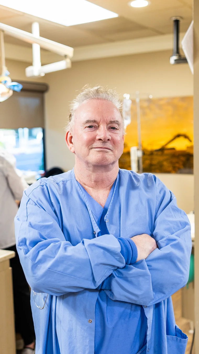 Dr. Donald Milne, MD, the board-certified anesthesiologist at Smith Sedation Dentistry, in scrubs in the treatment room
