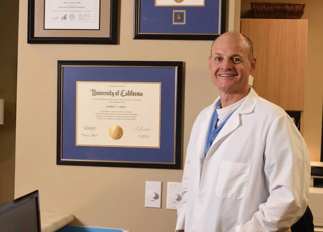 Dr. Rob Smith, DDS beside his University of California dental degree